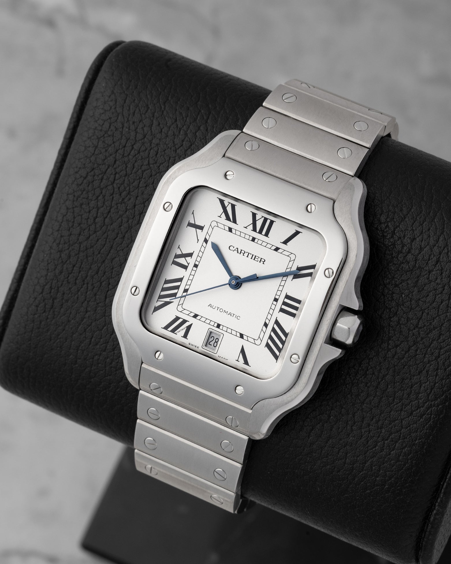 Angled view of pre-owned Cartier Santos de Cartier Large WSSA0018 featuring radial Roman numerals and blued-steel sword hands