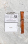 Additional tan calfskin leather strap with QuickSwitch system and original Cartier warranty paper included with Santos WSSA0018 set