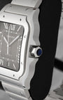 Close-up of seven-sided crown set with blue synthetic spinel on a Cartier Santos WSSA0096 stainless steel case