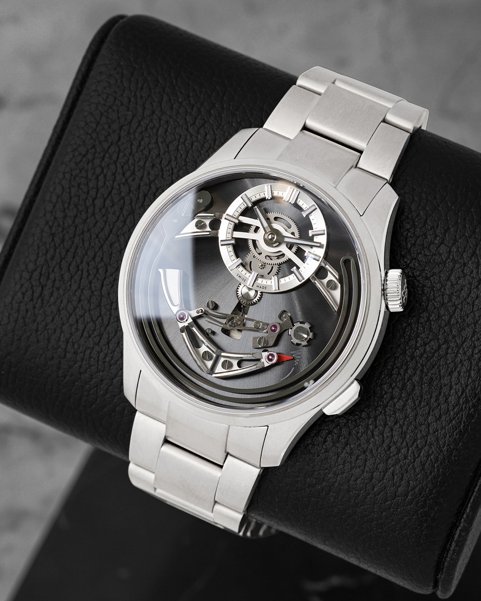 front view of Christopher Ward C1 Bel Canto Nero showing the openwork dial, chiming hammer mechanism, and titanium bracelet