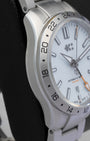 Close-up of the 24-hour fixed bezel and distinct orange GMT hand on a Christopher Ward C63 Sealander watch