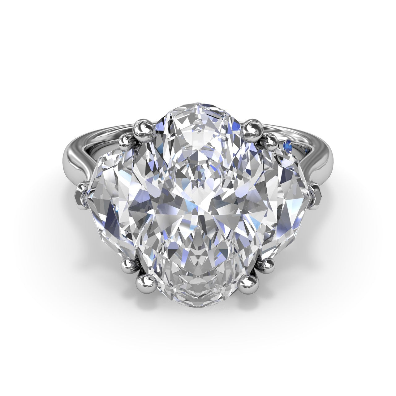 Studio front view of the Fana S4282 three stone ring, highlighting the structural transition between the oval center diamond and cadillac cut side stones