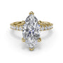 Forward-facing studio view of the Fana S4350 yellow gold engagement ring setting, showcasing the symmetrical pavé diamond band framing a brilliant marquise stone