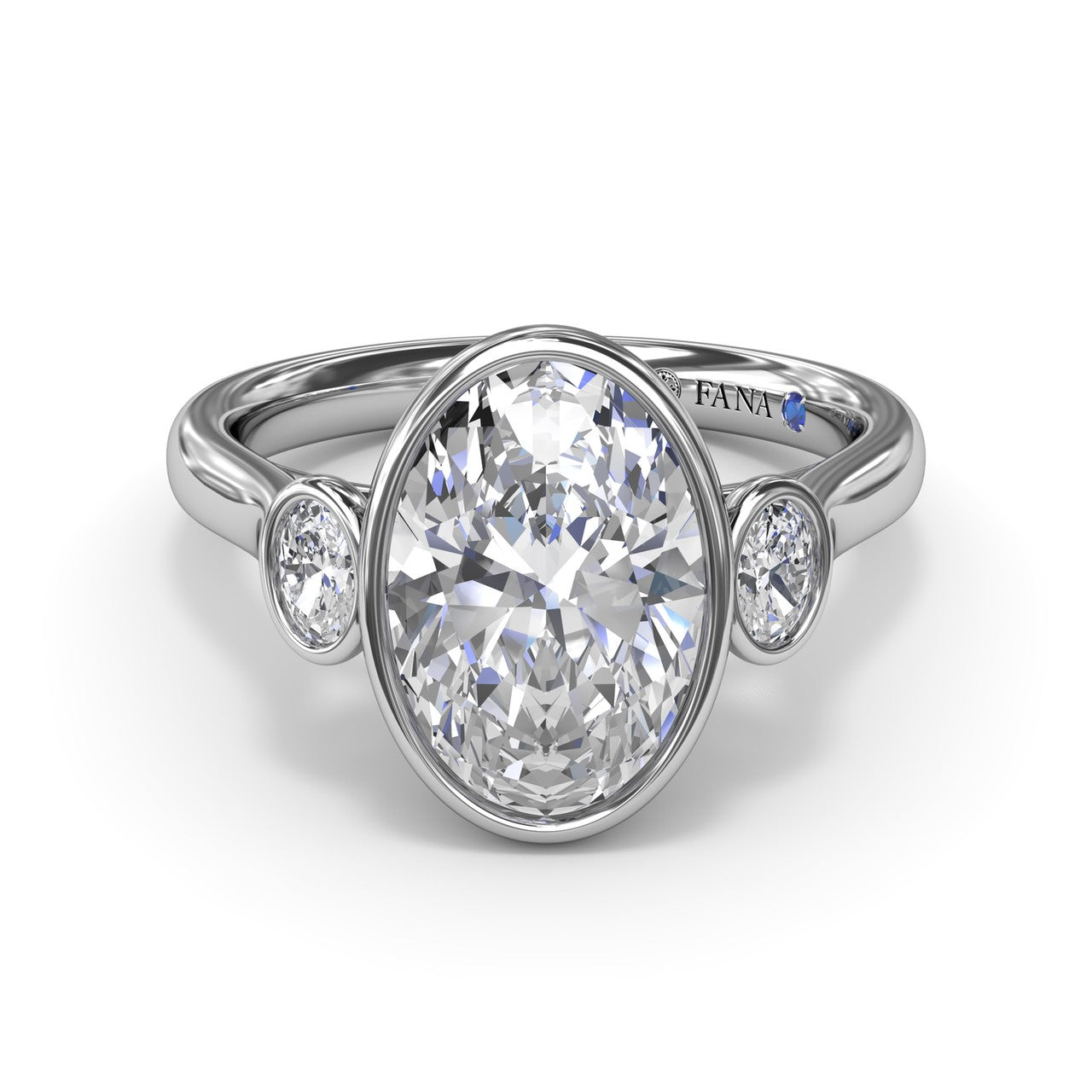 Studio front view of the Fana S4379 three stone ring, highlighting the smooth metal bezel borders enclosing the oval center and side diamonds