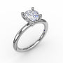 Fana 14k white gold solitaire engagement ring setting, style S4013, showing a polished knife-edge-style slender band and a four-prong head with a surprise collar diamond