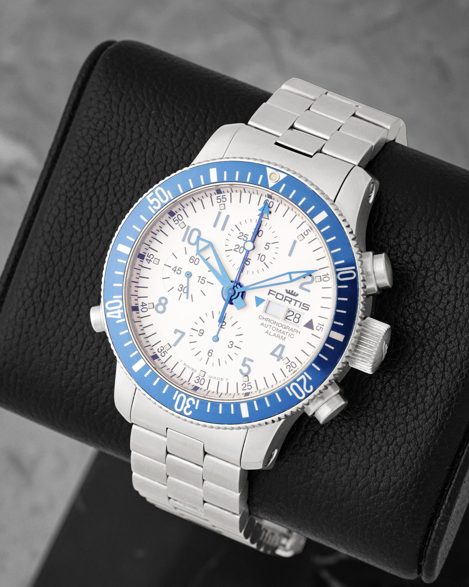 Three-quarter view of Fortis B-42 Diver Chronograph Alarm 641.10.170 featuring a white dial, blue timing bezel, and stainless steel bracelet