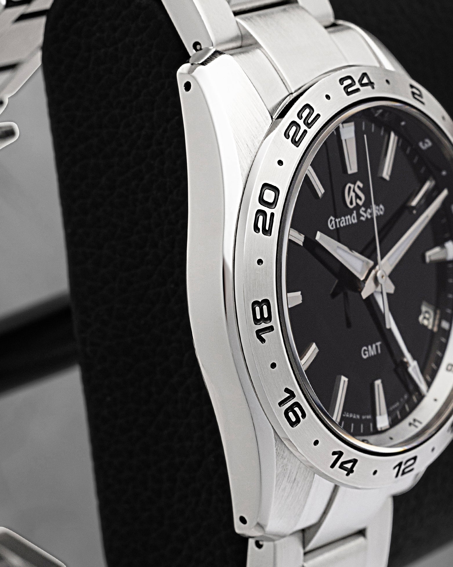 Distortion-free Zaratsu-polished case side profile view of pre-owned Grand Seiko Sport Collection GMT SBGN027G