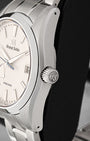 Close-up right profile view of the watch head highlighting the push-pull crown engraved with the GS logo and the distortion-free Zaratsu mirror polishing along the titanium bezel