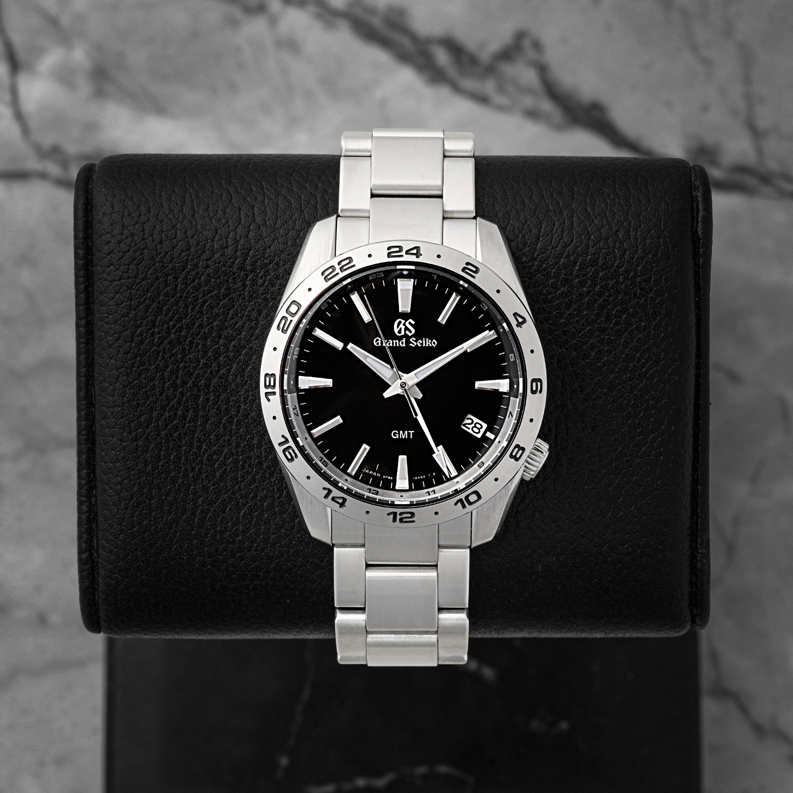 Preowned 2025 Grand Seiko Sport Collection GMT SBGN027G 39mm stainless steel watch with black sunray dial at Noah's Fine Watches & Jewelry in Dallas, Texas.
