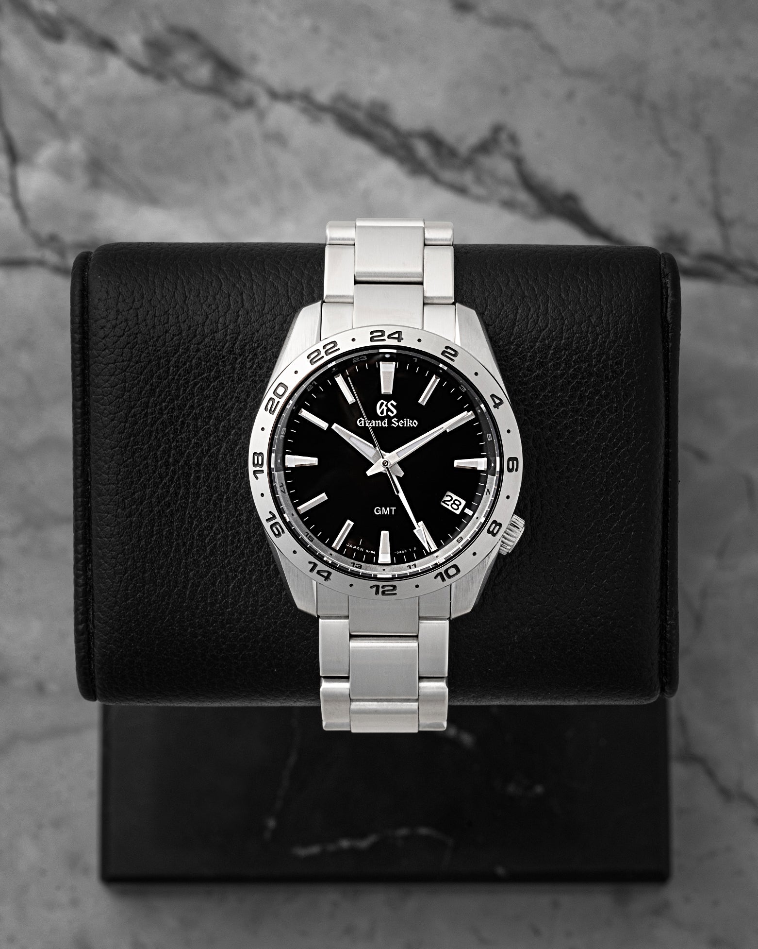 Preowned 2025 Grand Seiko Sport Collection GMT SBGN027G 39mm stainless steel watch with black sunray dial at Noah's Fine Watches & Jewelry in Dallas, Texas.