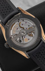 sapphire crystal exhibition caseback of the H. Moser Pioneer watch revealing the decorated in-house caliber HMC 200 automatic movement and rotor