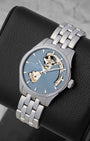 Angled view of a men's Hamilton Jazzmaster Open Heart watch, highlighting the unique skeleton dial cutouts