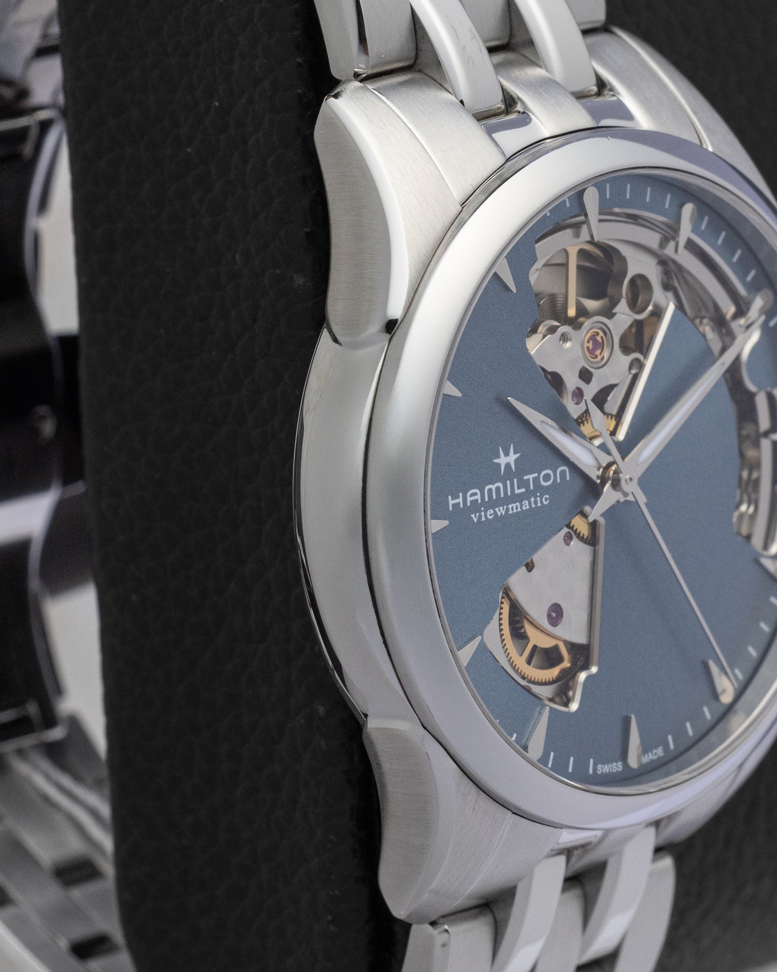 Side view of the polished stainless steel bezel and lugs on a Hamilton Jazzmaster automatic watch