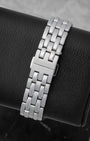 Engraved Hamilton branding on the folding deployment clasp of a stainless steel watch link bracelet