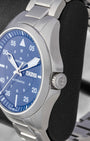 Close-up profile view of the brushed stainless steel case and crown guard on a Hamilton aviation watch