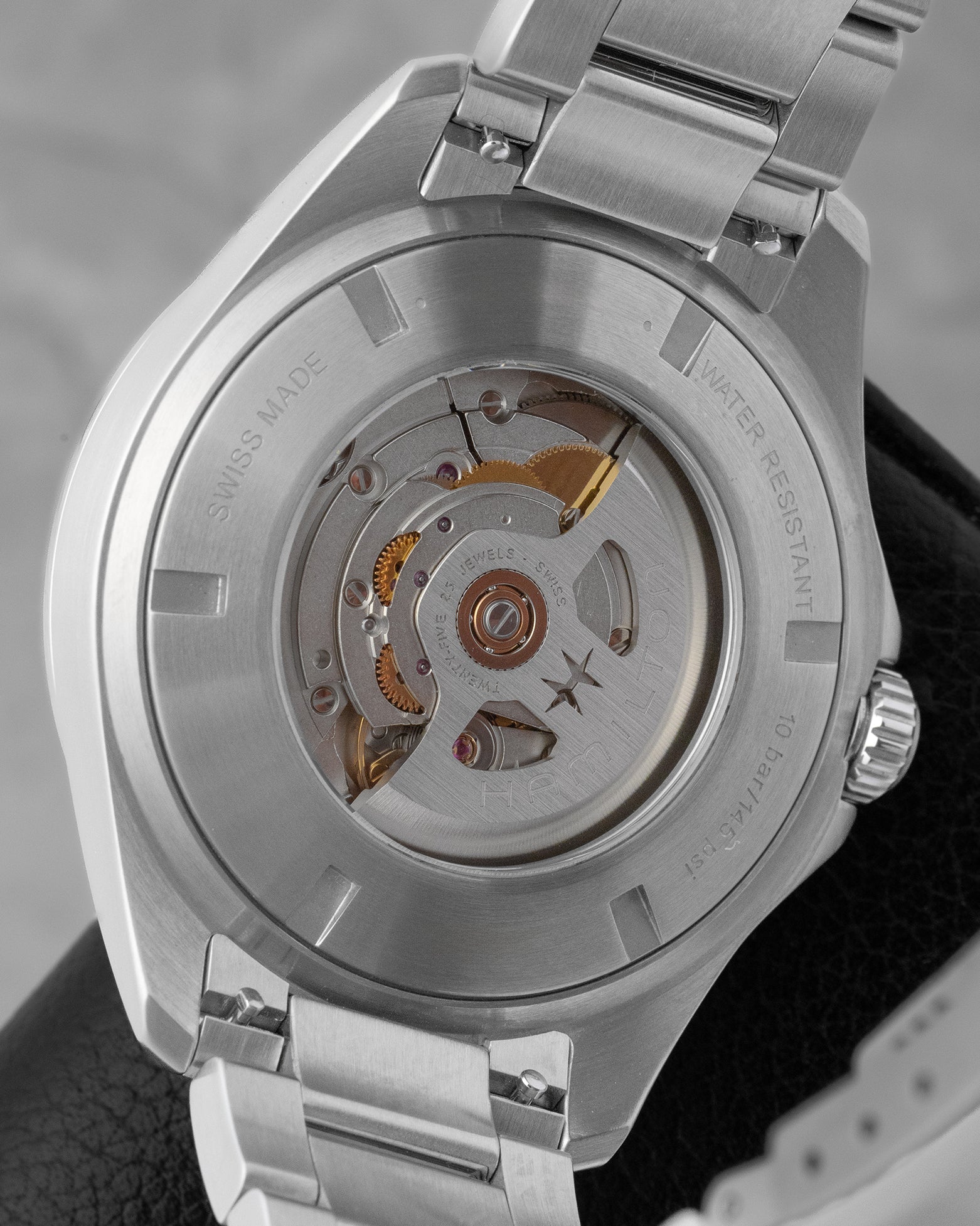 The open sapphire crystal exhibition caseback of a Hamilton watch displaying the H-30 automatic movement