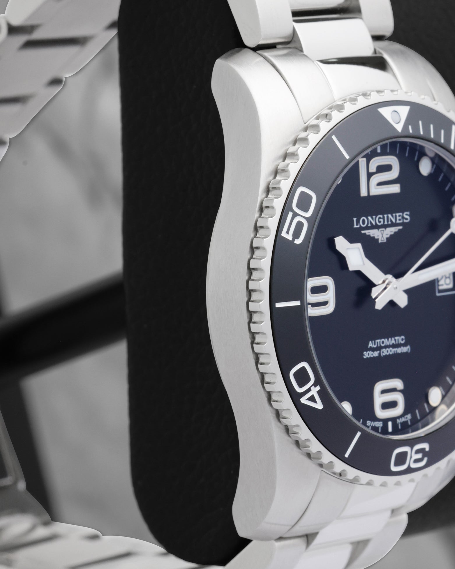 The official square white Hermès watch international warranty card and guarantee booklet with orange typography