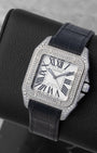 Angled view of an iced-out Cartier Santos 100 watch with pave-set diamonds and the black leather strap