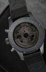 Rear exhibition view through the specialized dark tinted sapphire crystal caseback, revealing the IWC-manufactured caliber 69385 automatic movement