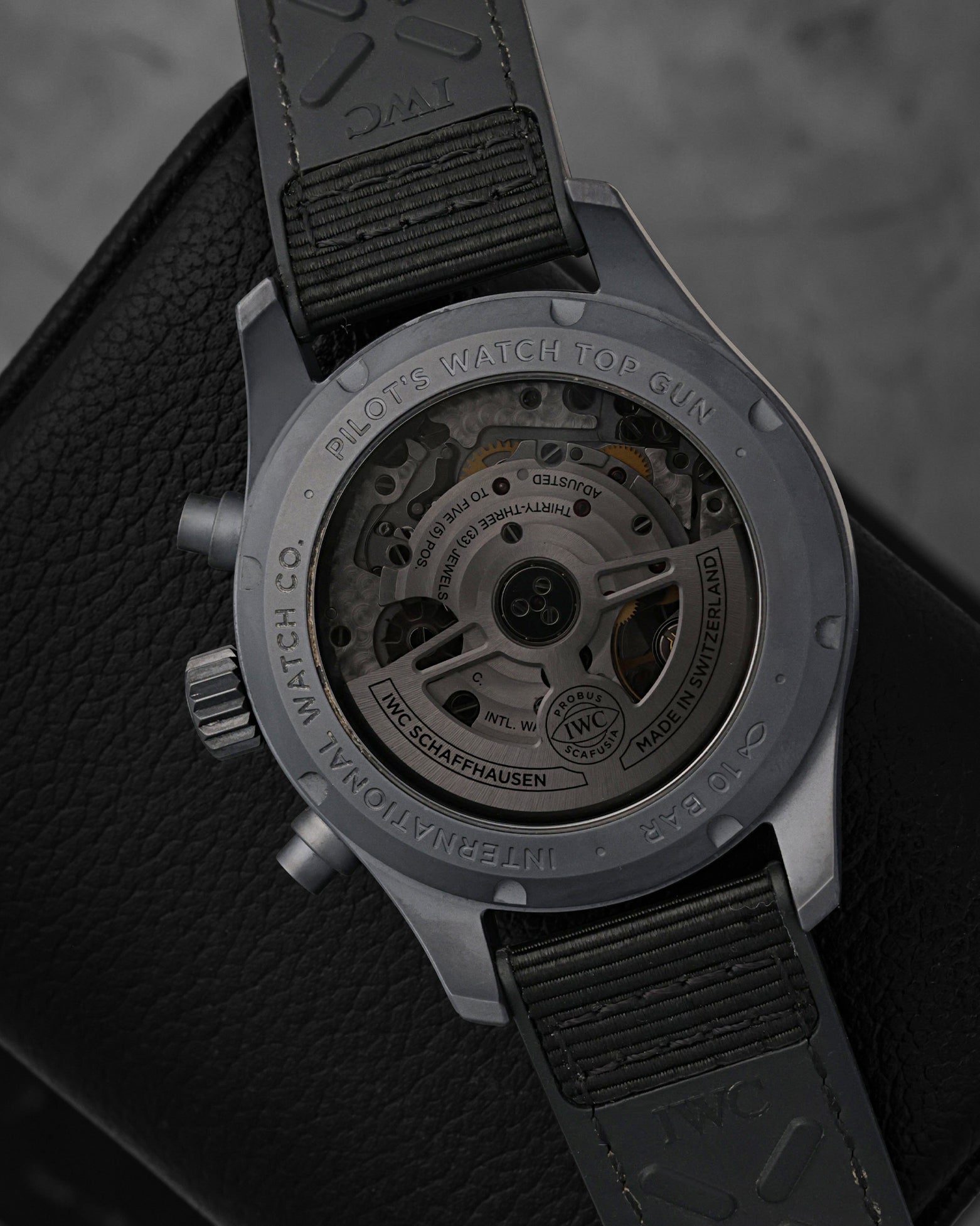 Rear exhibition view through the specialized dark tinted sapphire crystal caseback, revealing the IWC-manufactured caliber 69385 automatic movement