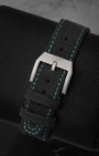 Black embossed calfskin leather strap with green contrast stitching and titanium pin buckle