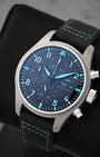 Angled front view of IWC Pilot's Chronograph 41 Titanium with Petronas Green luminous hands and numerals