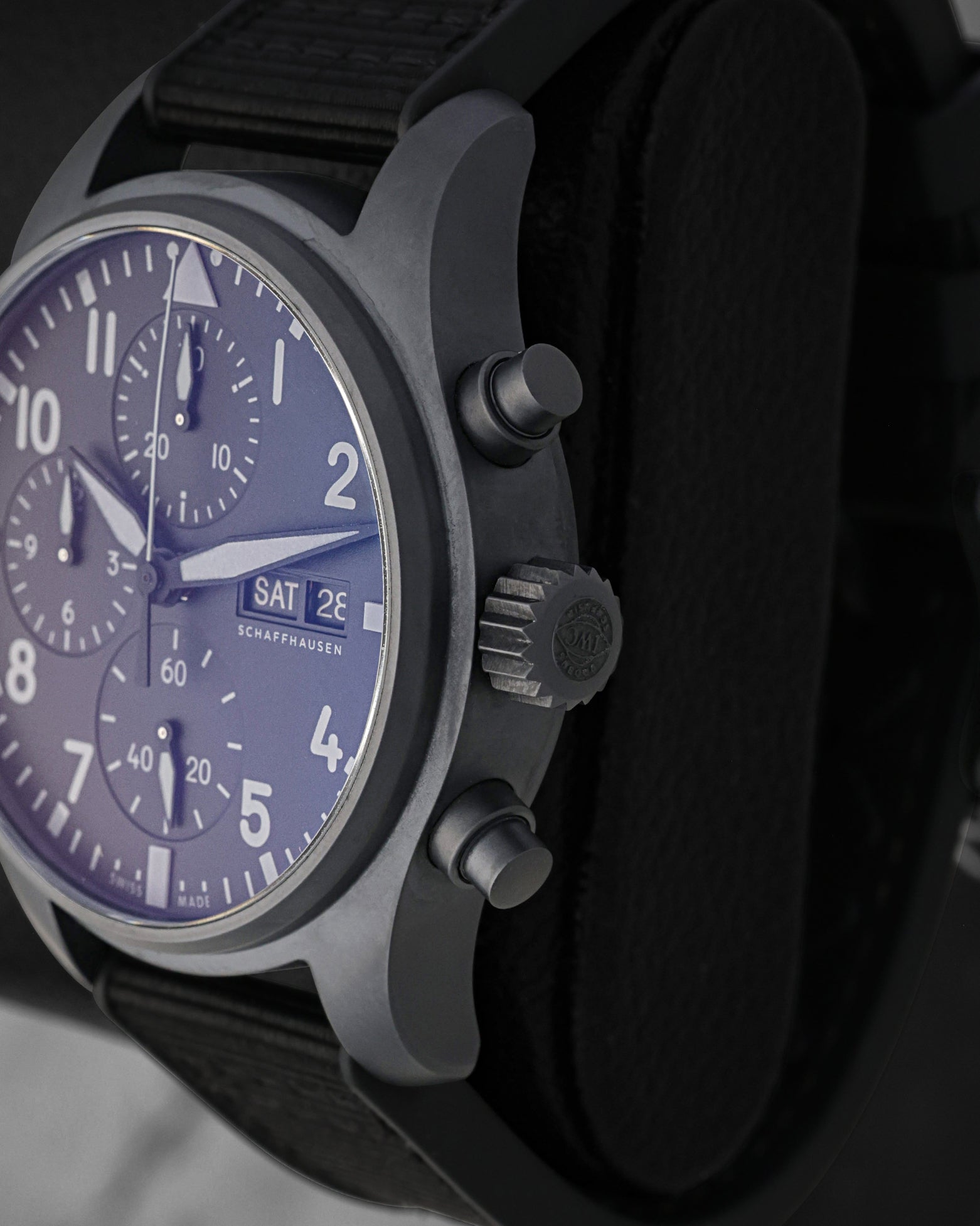 Side profile shot focusing on the patented Ceratanium case finish, screw-down winding crown, and tactile chronograph pushers on the IWC Pilot 41