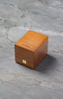 Original brown wooden Jaeger-LeCoultre luxury watch presentation box on a grey background