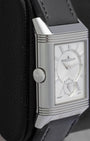 Close-up macro photo of the rectangular stainless steel case crown of a Jaeger-LeCoultre Reverso luxury watch