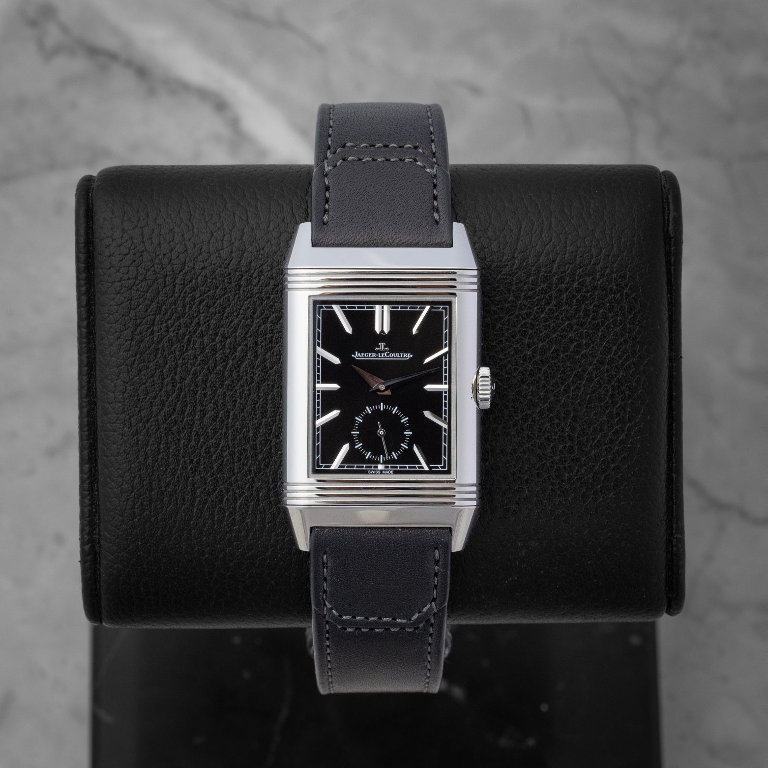 Jaeger-LeCoultre Reverso Tribute Duoface watch showing the black sunray-brushed dial with silver applied indexes and small seconds subdial