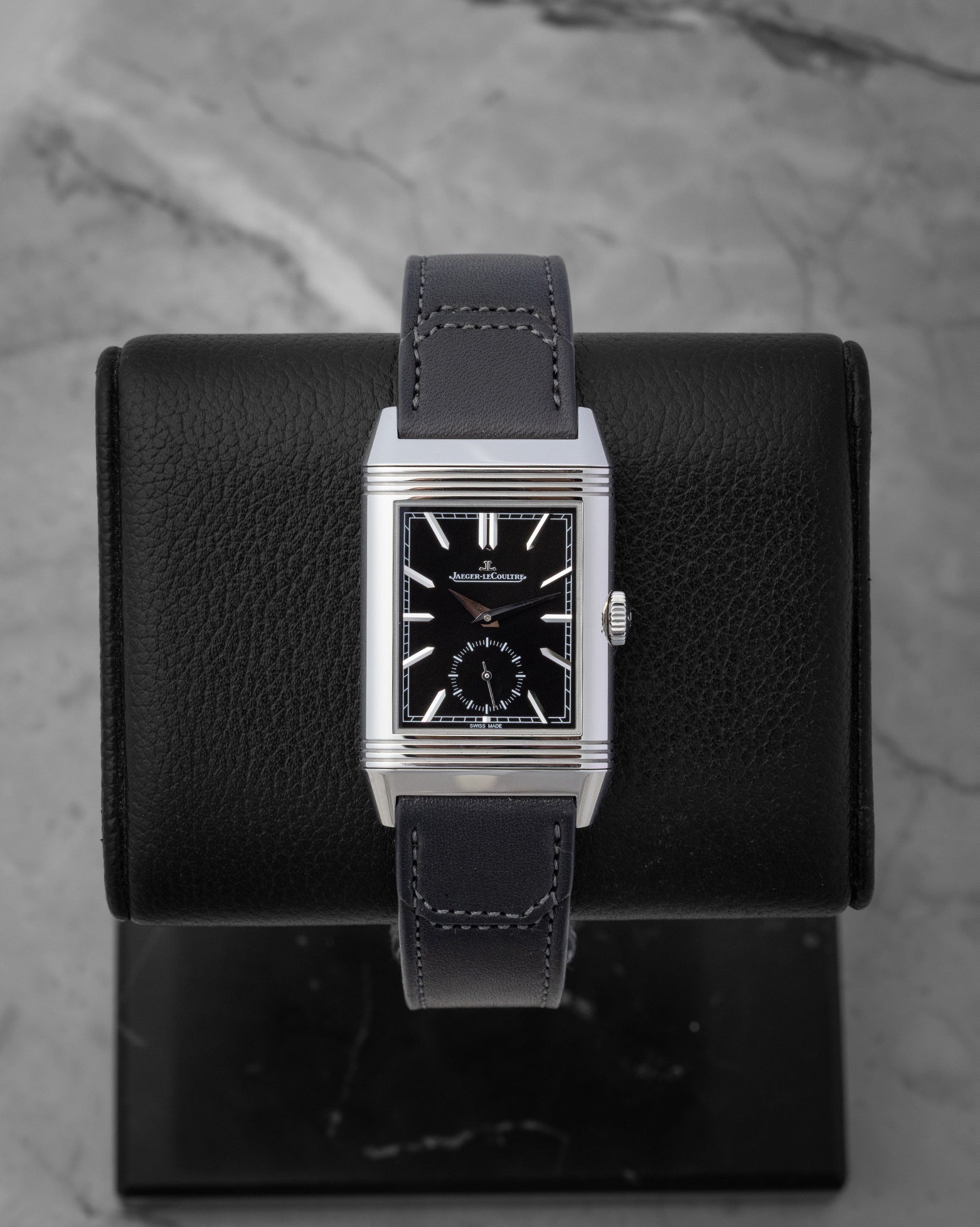 Jaeger-LeCoultre Reverso Tribute Duoface watch showing the black sunray-brushed dial with silver applied indexes and small seconds subdial