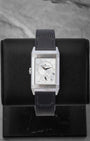 The reversed side of the Jaeger-LeCoultre Duoface watch, showcasing a silvered-grey sunray dial with a 24-hour night and day indicator