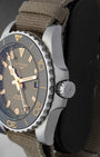 Side view highlighting the screw-down crown, crown guards, and ceramic bezel of the green Longines HydroConquest GMT