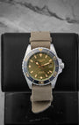 Green dial Longines HydroConquest GMT 41mm watch, model L3.790.4.06.2, on a khaki green fabric strap at Noah's Fine Watches & Jewelry in Dallas