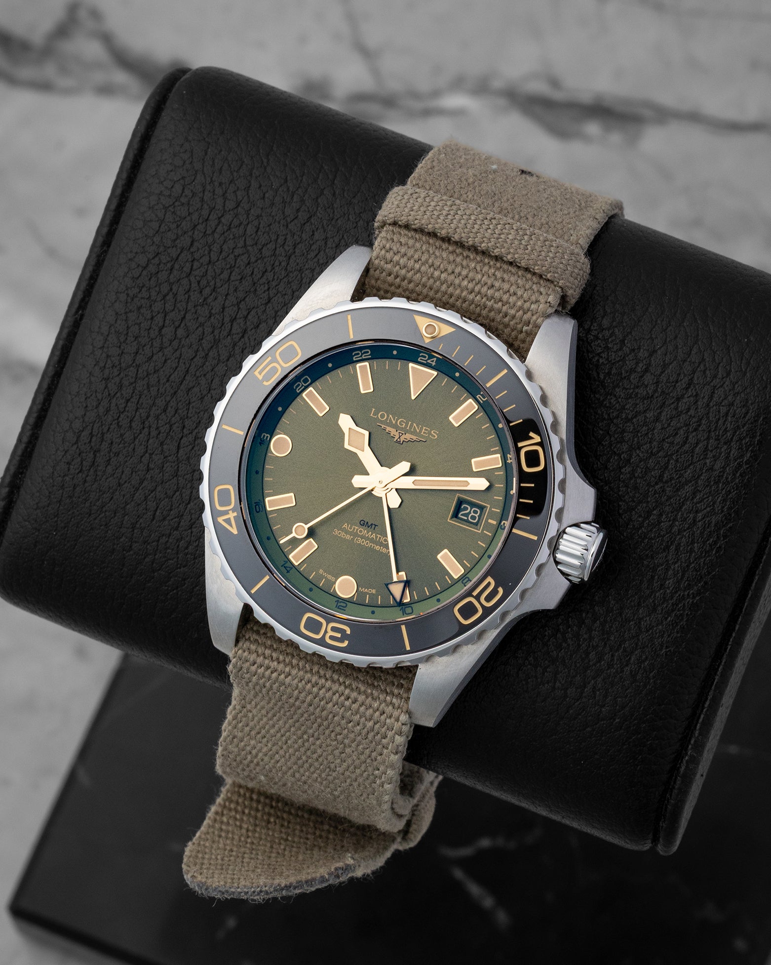Front angled view of the green ceramic bezel Longines HydroConquest GMT automatic watch in Dallas
