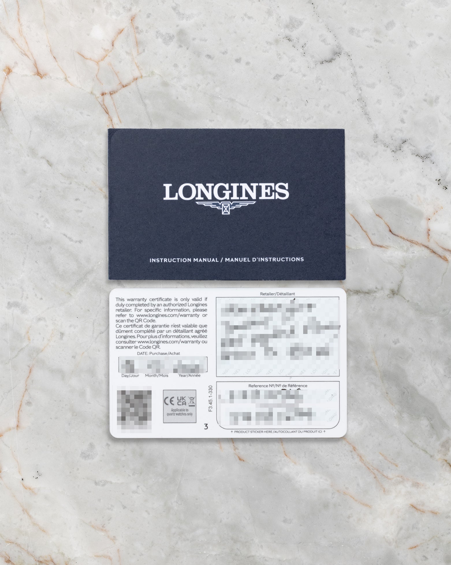 "The official blue and white Longines international warranty card with handwritten dealer purchase details laid flat on a marble background