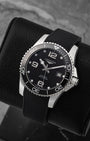 Angled front view of pre-owned Longines HydroConquest L3.781.4.56.9 featuring a black dial, Arabic numerals, date display, and unidirectional rotating ceramic bezel
