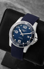 Angled front view of preowned Longines HydroConquest L3.781.4.96.9 featuring a blue dial, luminous hour markers, date display, and unidirectional rotating ceramic bezel