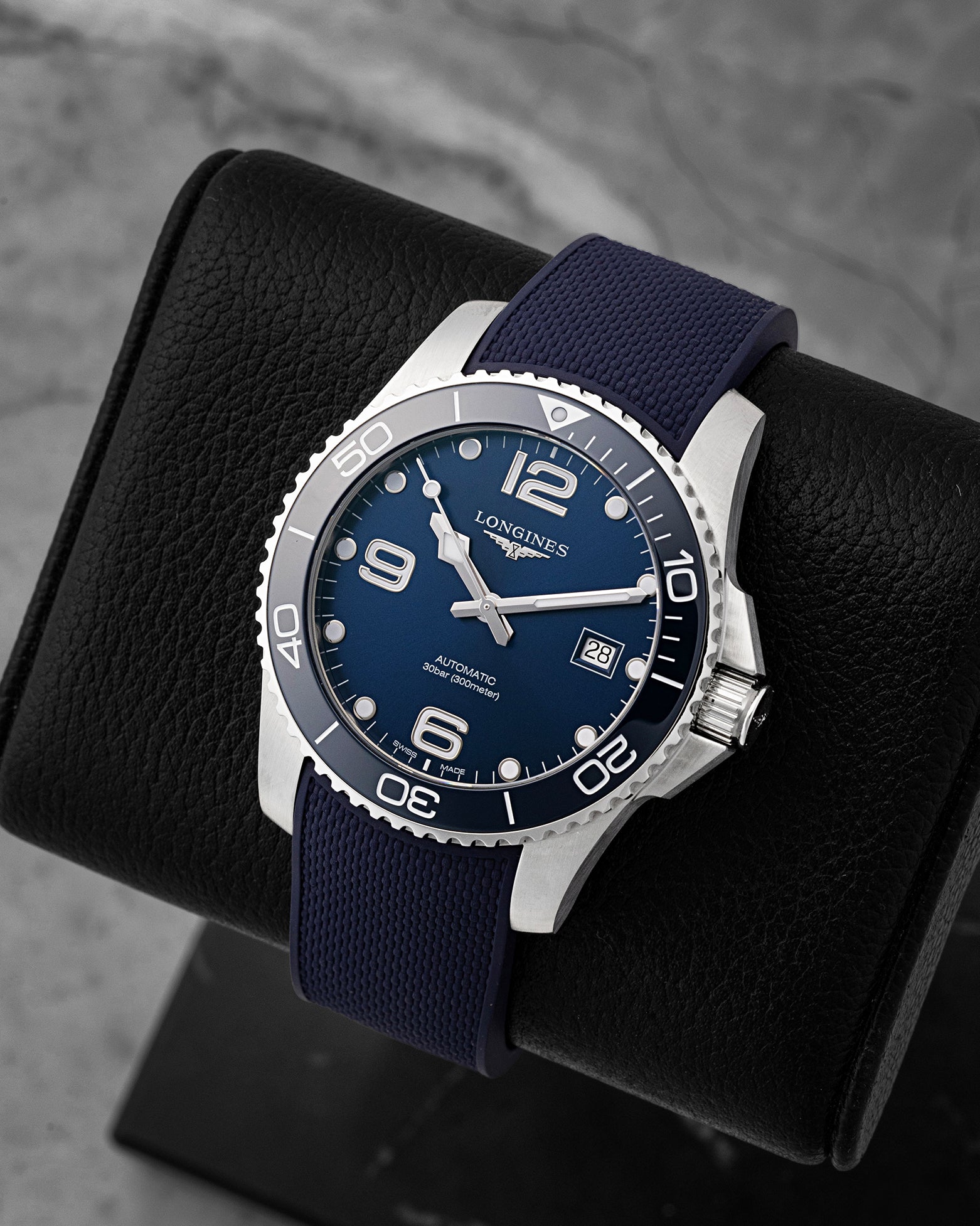 Angled front view of preowned Longines HydroConquest L3.781.4.96.9 featuring a blue dial, luminous hour markers, date display, and unidirectional rotating ceramic bezel