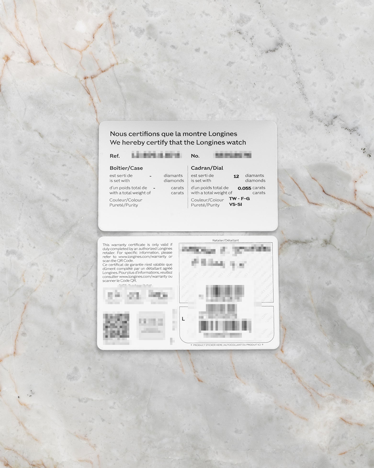 A top-down flat lay view of the official 2026 printed international warranty smart card resting alongside the factory matching barcode reference tag over a grey marble surface