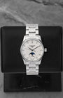 A 2026 Longines Master Collection Moonphase 34mm reference L2.409.4.87.6 showcasing its white mother-of-pearl dial, brilliant-cut diamond hour markers, and midnight blue moonphase indicator at Noah's Fine Watches & Jewelry in Dallas