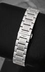 A rear portrait of the high-polished and brushed steel bracelet focusing on the seamless closure of the hidden butterfly push-button deployment buckle stamped with the Longines logo