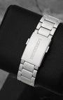 A rear view of the satin-finished three-link steel bracelet focusing on the flush interface of the folding deployment buckle engraved with the classic Longines block typography