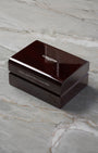 A high-angle three-quarter shot of the premium dark brown lacquered wood grain watch presentation chest resting on a grey marble backdrop