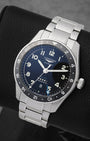 A high-angle three-quarter view of the 42mm stainless steel Zulu Time case showcasing its bi-directional rotating ceramic bezel insert with a 24-hour graduate scale