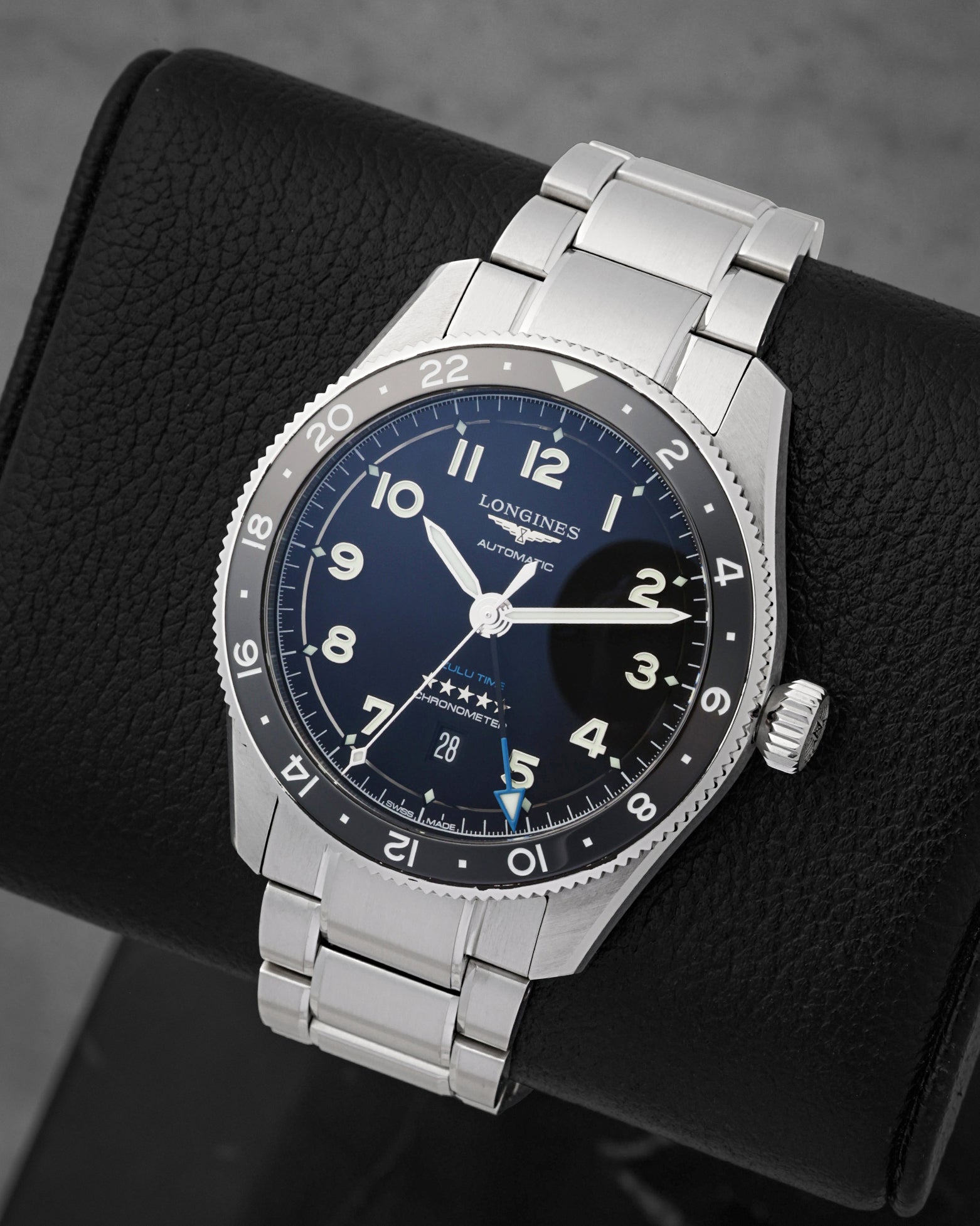 A high-angle three-quarter view of the 42mm stainless steel Zulu Time case showcasing its bi-directional rotating ceramic bezel insert with a 24-hour graduate scale