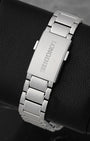A rear view of the satin-finished three-link steel bracelet focusing on the flush interface of the folding deployment buckle engraved with the classic Longines block typography
