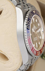 Left side perspective highlighting the bidirectional rotating knurled edge bezel and the high-contrast red and blue Cerachrom ceramic 24-hour insert