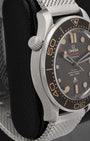 Left side perspective showcasing the clean matte finish of the lightweight titanium case and the prominent conical helium escape valve at 10 o'clock