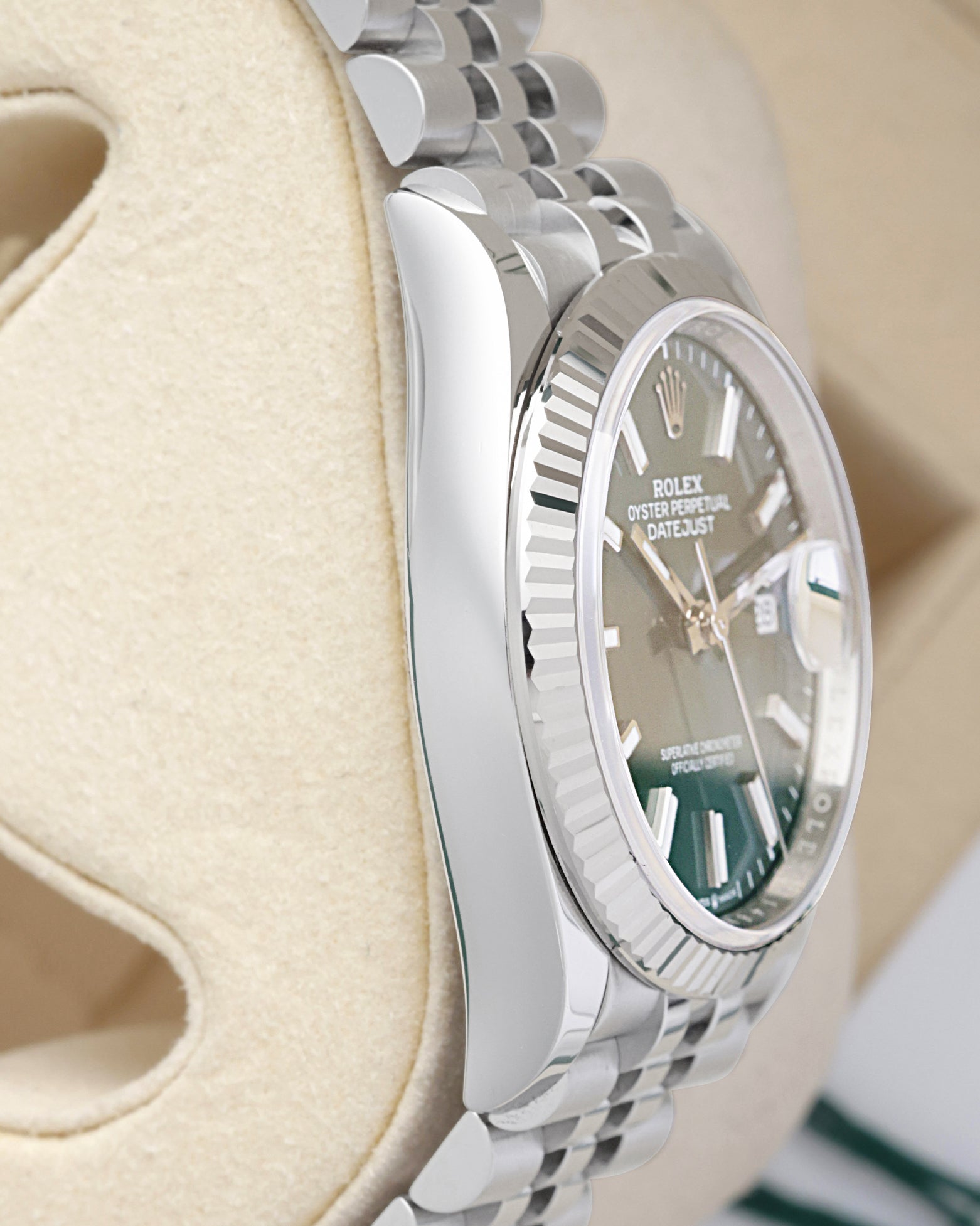 Side profile view of the polished 904L stainless steel Oyster case on the non-crown side of a Rolex Datejust 126234